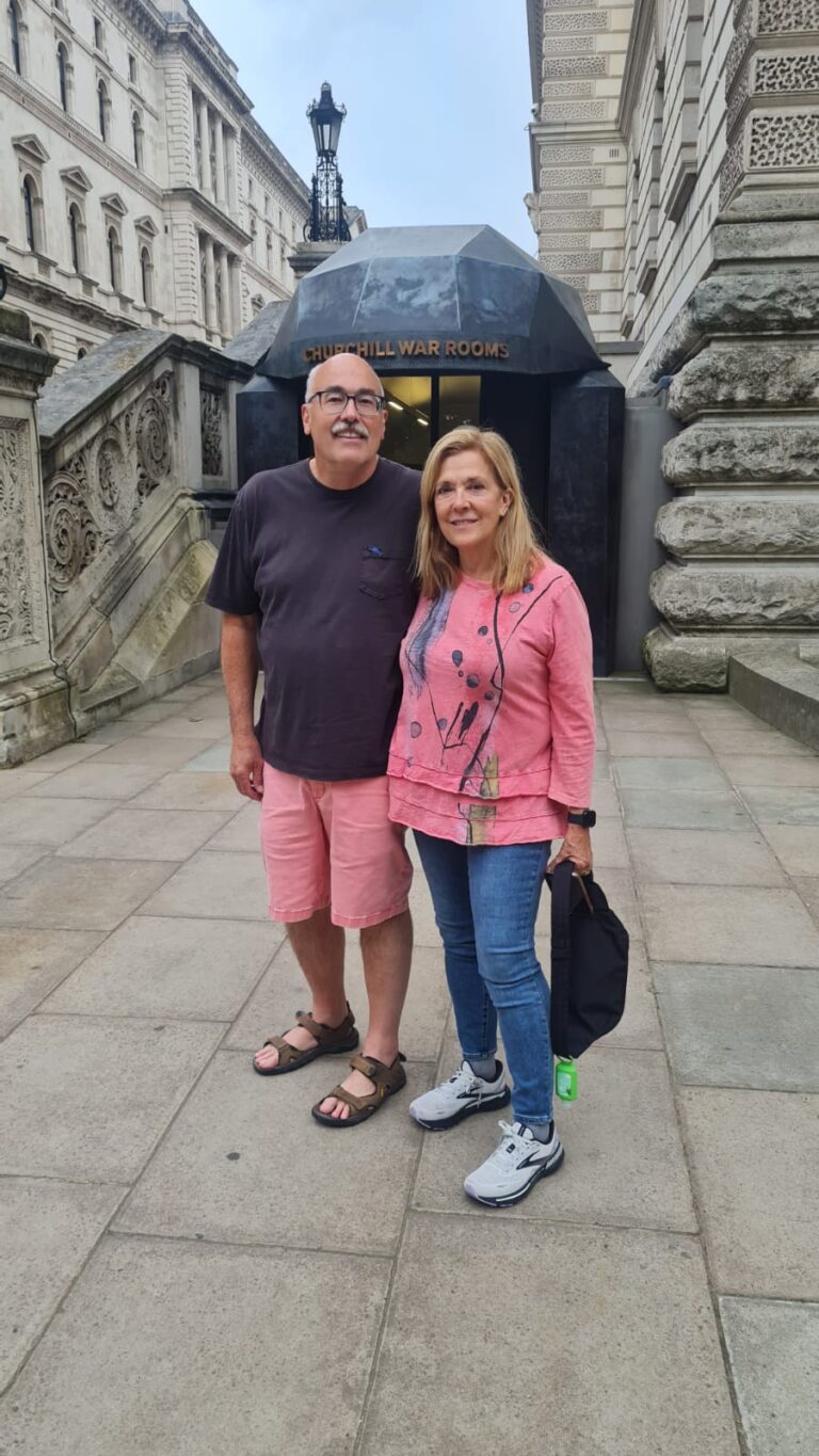 Tourists enjoying unique half-day sightseeing routes in London from a black cab.