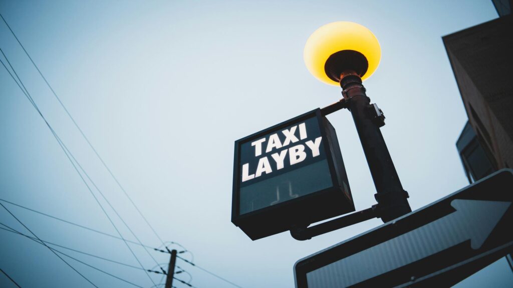 Tourists taking photos of TV series location from black cab