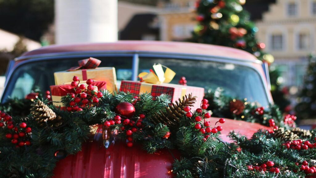 London taxi decorated for Christmas in front of London Eye