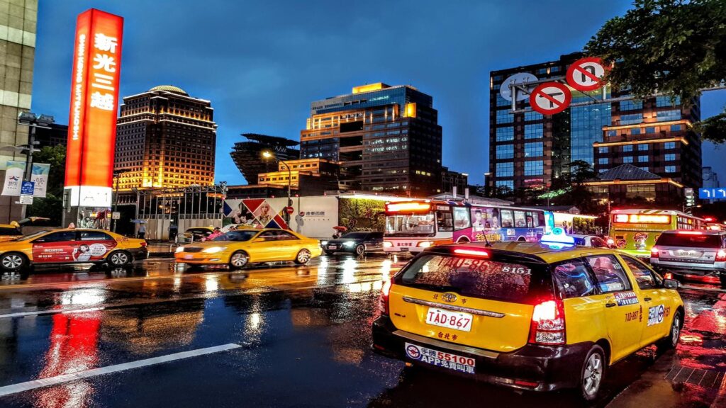 London black cab in front of illuminated West End theatre signs