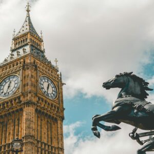 Black taxi cab in front of Big Ben offering door-to-door tours