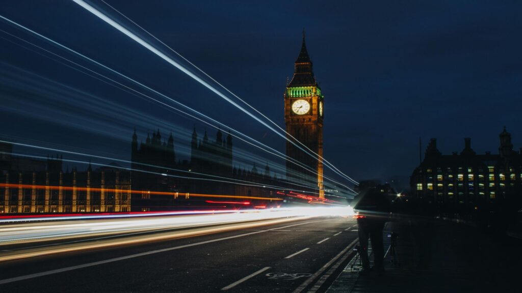 Black taxi in front of the London Eye