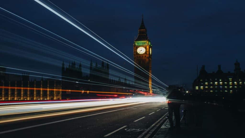 Tourists pointing at London Eye from inside a black cab