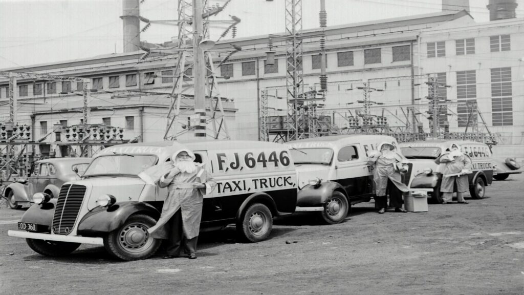 Black cab near Thames river boat dock