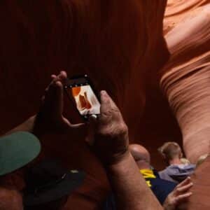 Tourists capturing the beauty of Antelope Canyon during a guided tour.