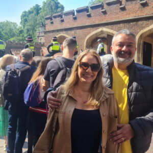 Tourists enjoying day trips from London, featuring iconic sights and mounted police in the background.