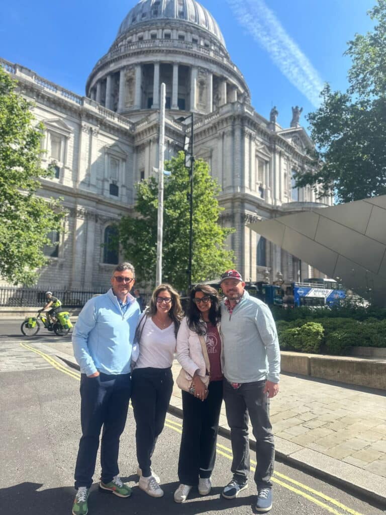 Group enjoying a London sightseeing tour near St. Paul's Cathedral, one of the best places to visit in London UK.