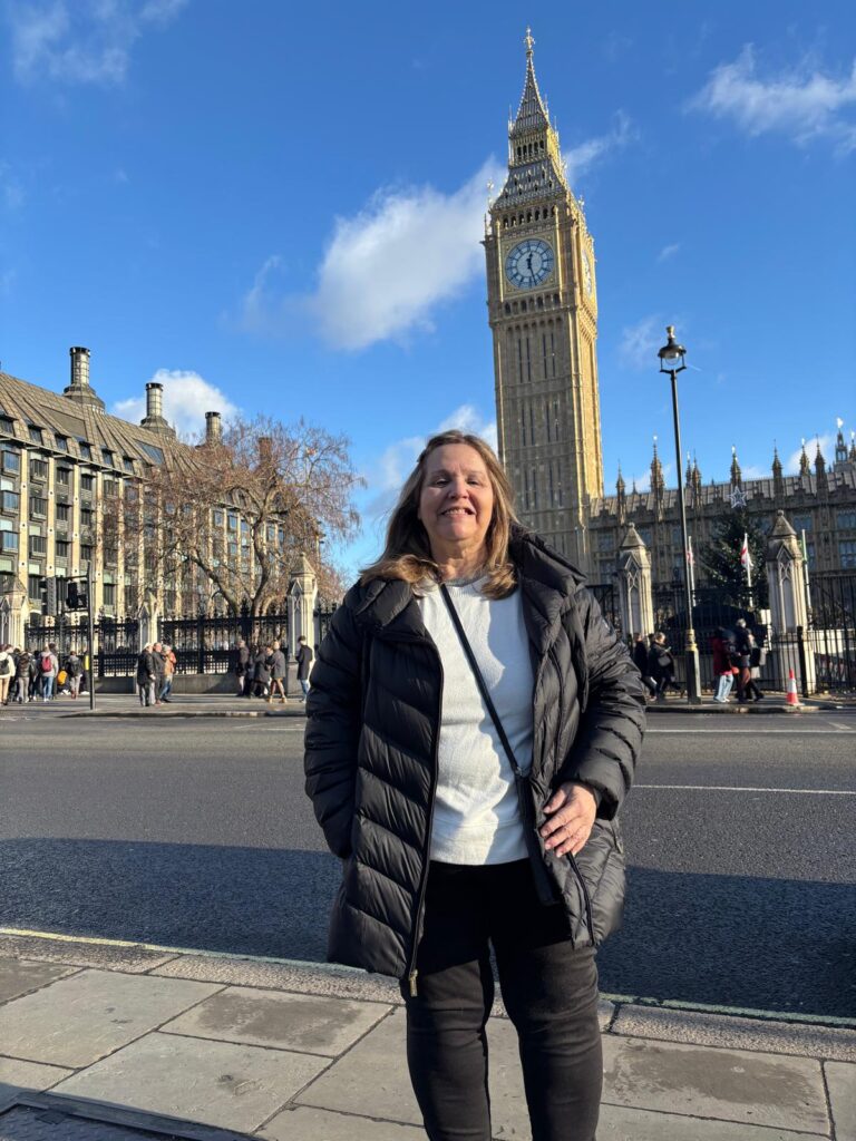 Tourist standing near Big Ben, one of the Top Attractions In London UK