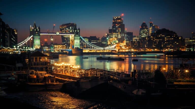 View of Tower Bridge and London skyline at night