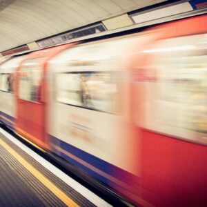 Blurred image of a moving train in a London underground station