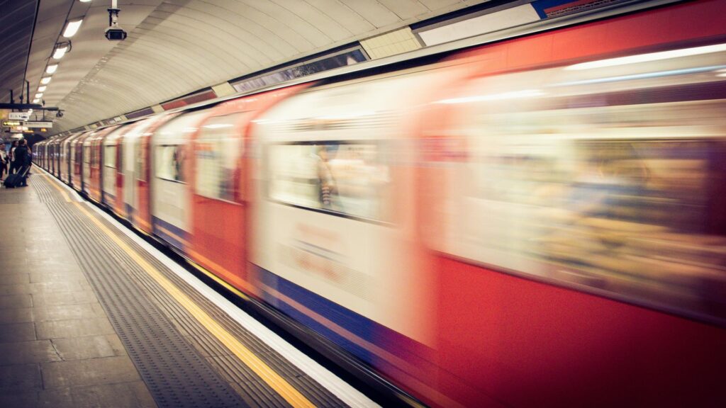 Blurred image of a moving train in a London underground station