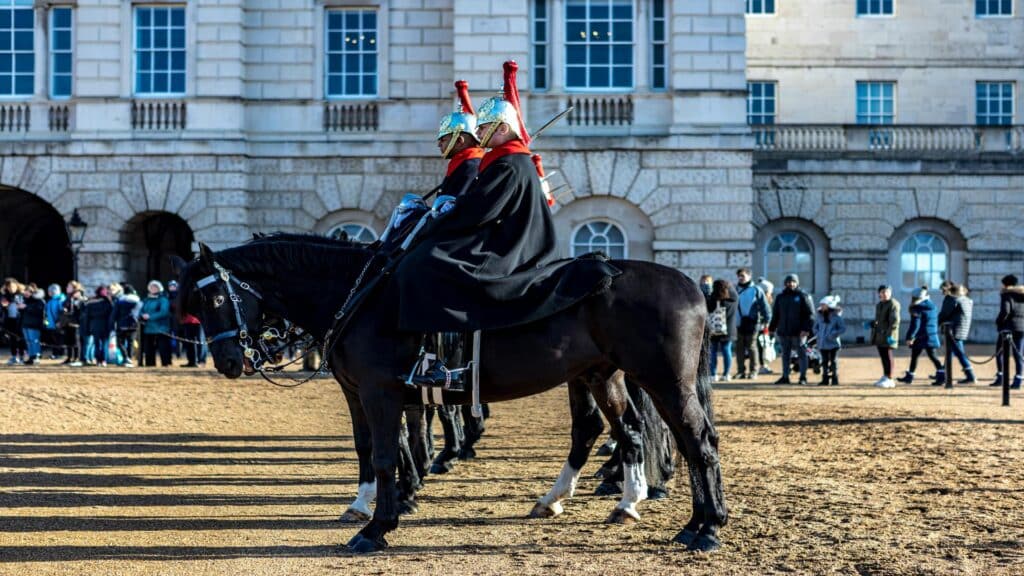 Horse Guards Parade during a Day Tour from London, showcasing ceremonial guards on horseback in traditional attire.