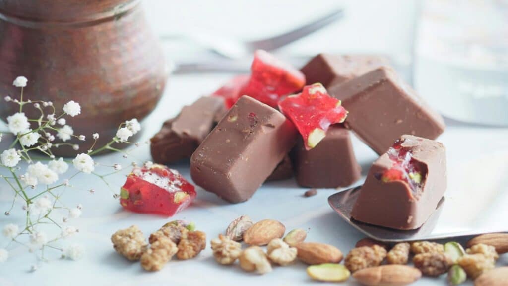 Assorted kosher chocolate treats with nuts and dried fruits.