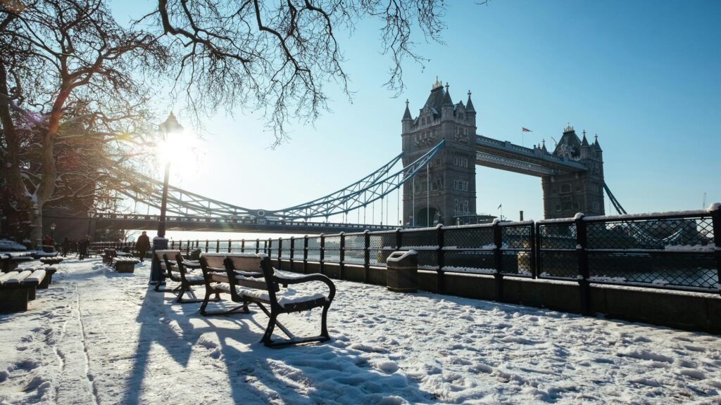 Snow-covered pathway with Tower Bridge in the background