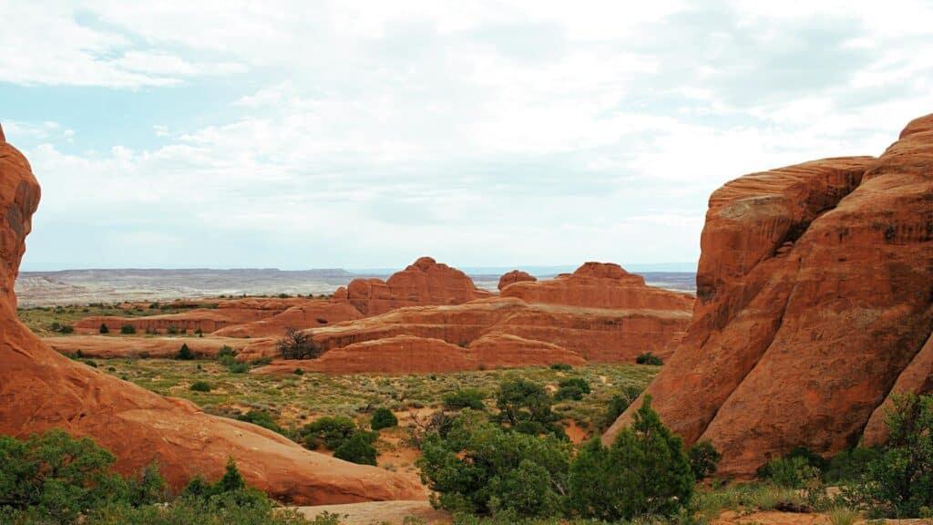 Scenic view of red rock formations and desert vegetation