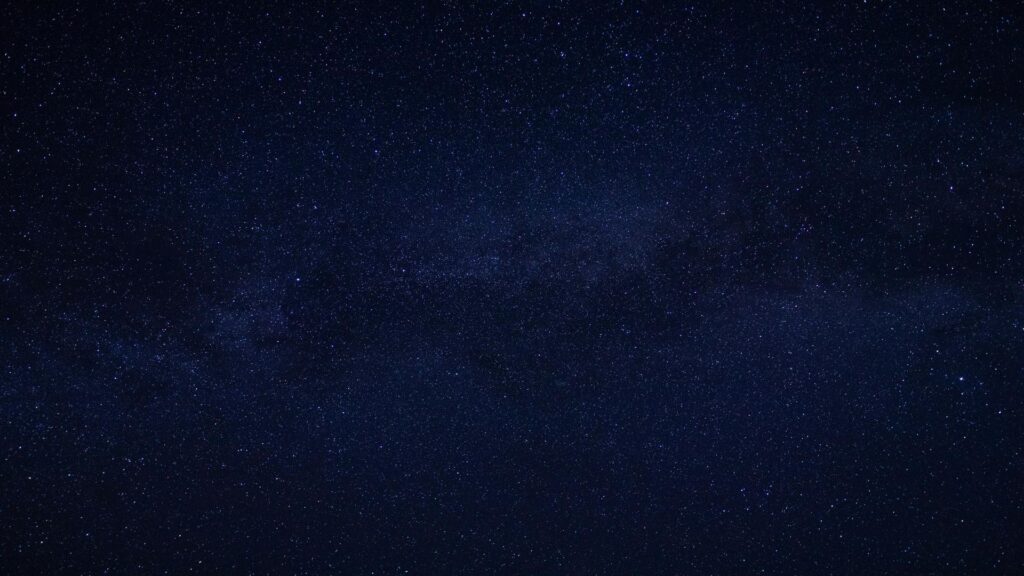 A clear view of a starry night sky with countless stars visible.