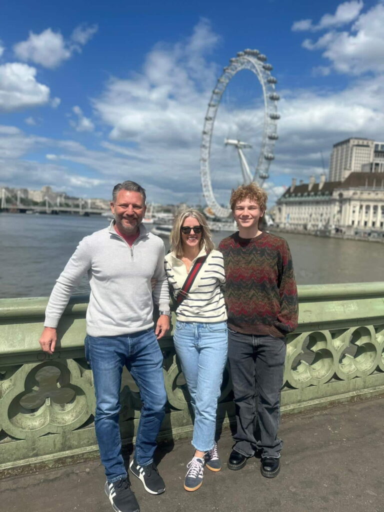 Family enjoying London sightseeing near the London Eye with Best Airport Transfers London services