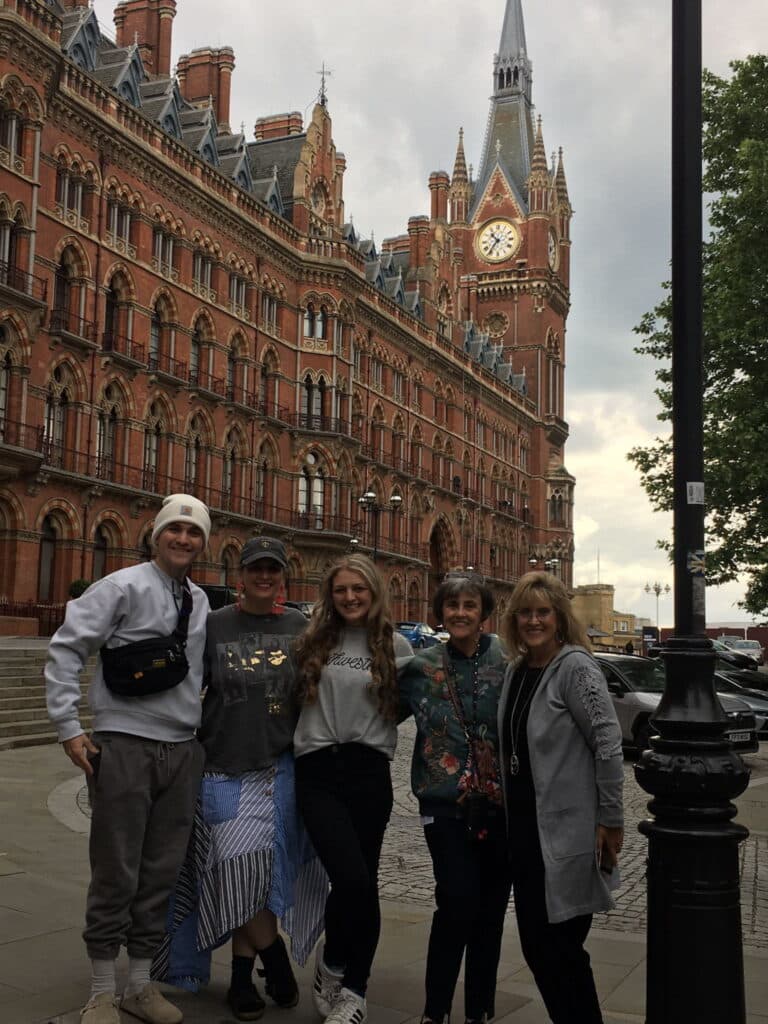 Group of people posing in front of St. Pancras Renaissance Hotel during London Tours For Families