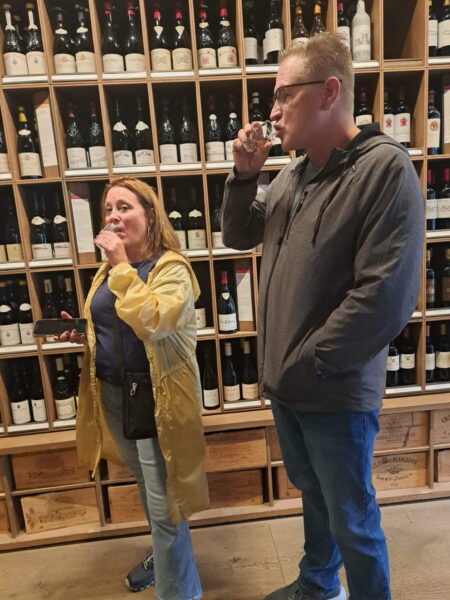 Visitors enjoying wine tasting during London Christmas Tours