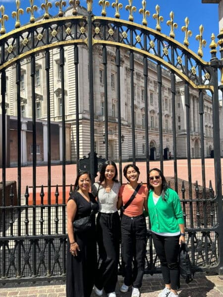 Group visiting Buckingham Palace gates during a London day trip