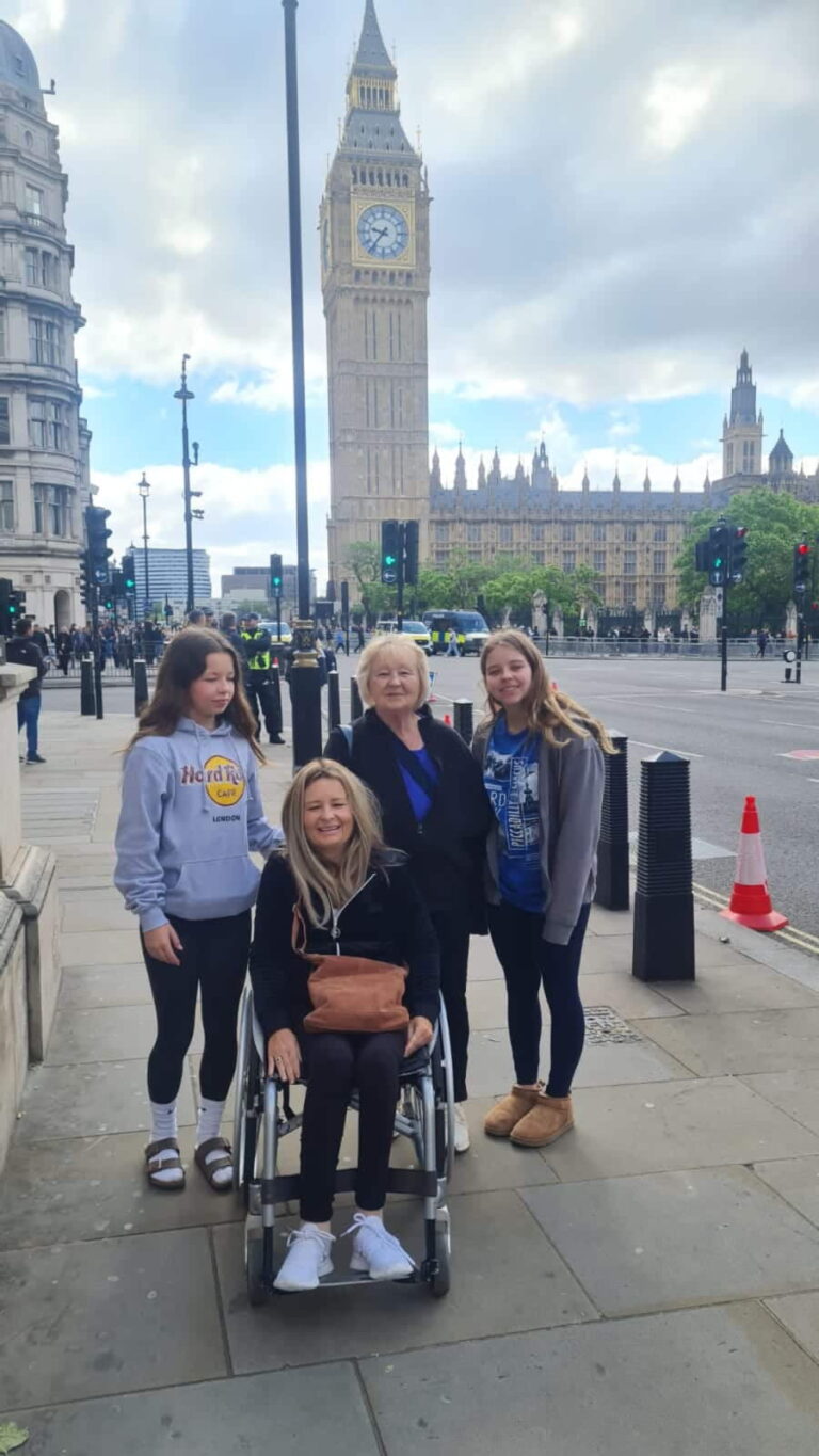 Group enjoying a sightseeing tour in London, England, with wheelchair accessibility near Big Ben.