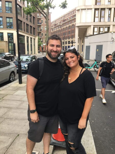 Couple smiles while enjoying a London Local Tour with London Sightseeing Taxi Tours.
