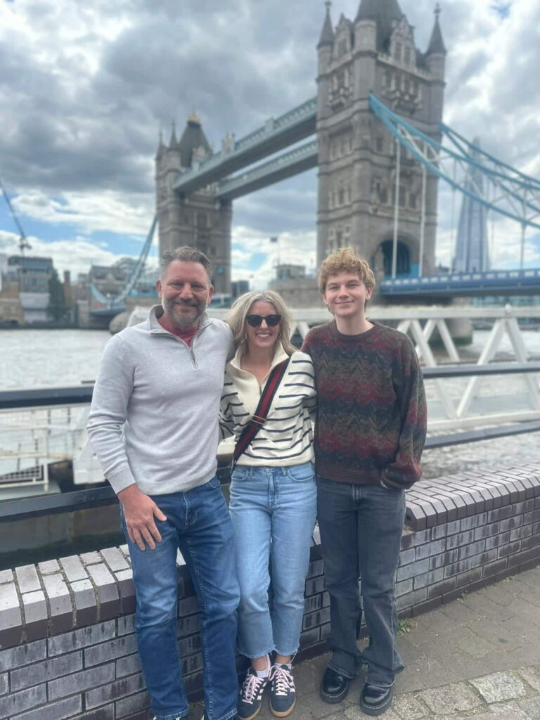 Family on Luxury Tours London sightseeing near Tower Bridge, enjoying a premium travel experience.