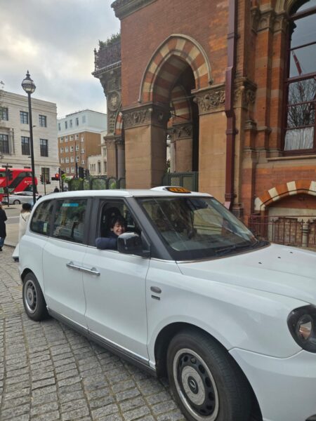 Best Way To Tour London In A Day - White taxi near iconic London architecture