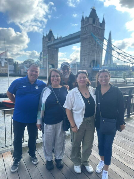 Group of tourists enjoying Secret Tours London at Tower Bridge, providing private sightseeing taxi tours of iconic London landmarks
