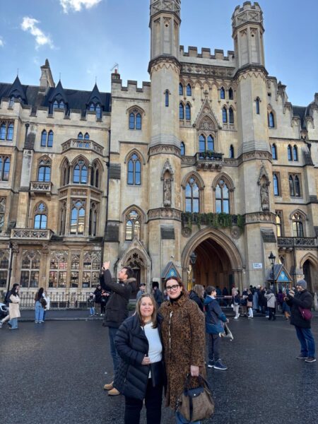 Tourists enjoying Exclusive London Tours at a Gothic landmark with London Sightseeing Taxi Tours