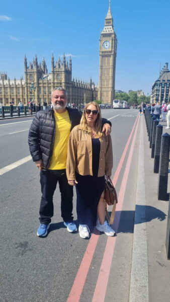 Best Tours Outside Of London - Tourists enjoying a London sightseeing taxi tour near Big Ben and the Houses of Parliament