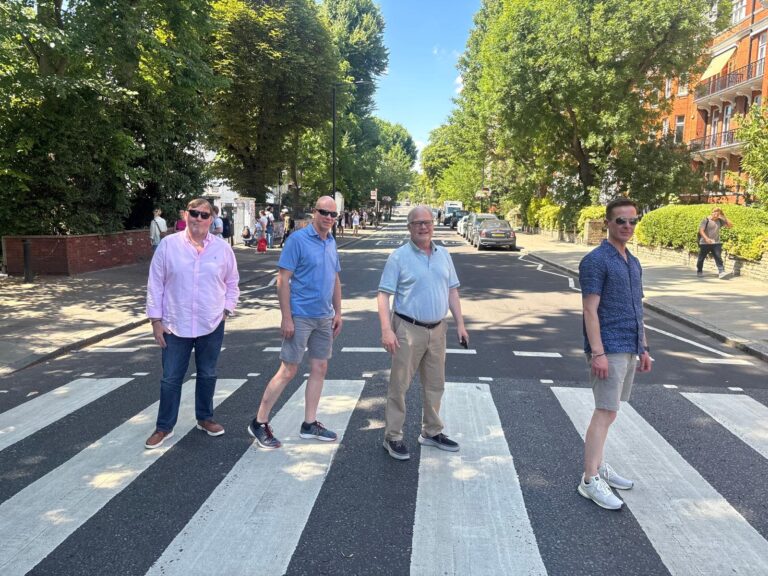 Group enjoying iconic London sights via taxi tours.