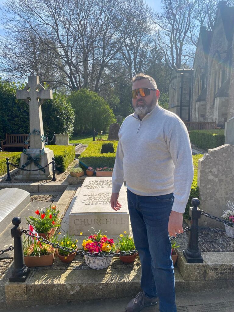 Visitor at Sir Winston Churchill's grave - Most Interesting Places In London tour stop