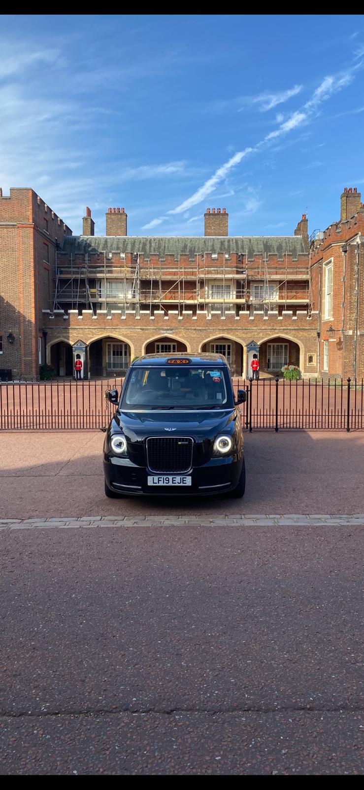 London Sightseeing Taxi Tours visiting Famous Sites In London England wheelchair accessible taxi in front of a historic London site