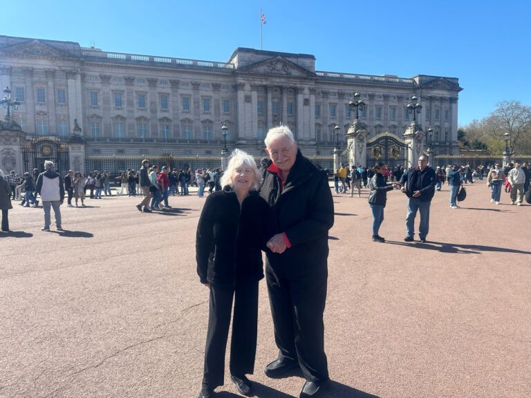 Best Place Visit In London - Visitors at Buckingham Palace with London Sightseeing Taxi Tours enjoying a group tour experience