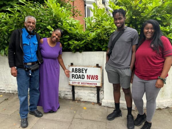 Free Walking Tours London UK group posing by Abbey Road sign