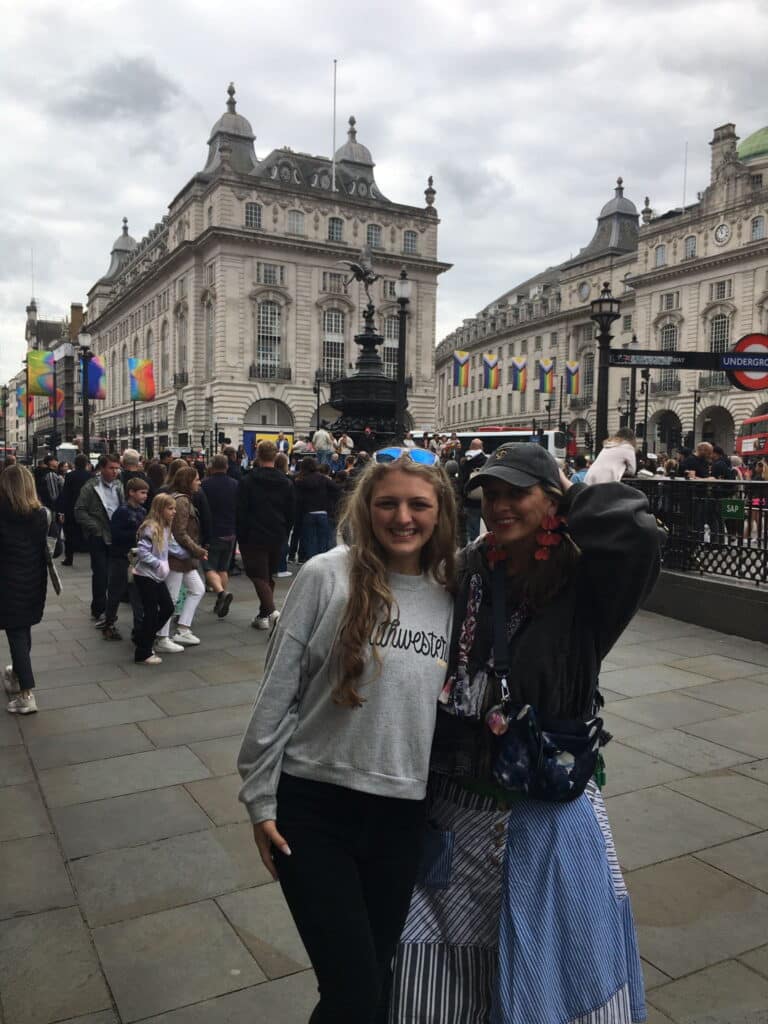 Things To Do In London Book - Piccadilly Circus with tourists enjoying London Sightseeing Taxi Tours