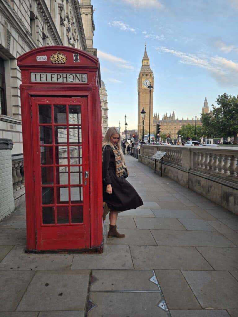 Visitors capturing moments at Tower Bridge while on London sightseeing taxi tour.