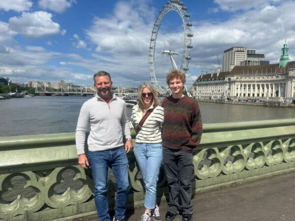 One Day Trip Around London visitors enjoying sightseeing taxi tour near the London Eye