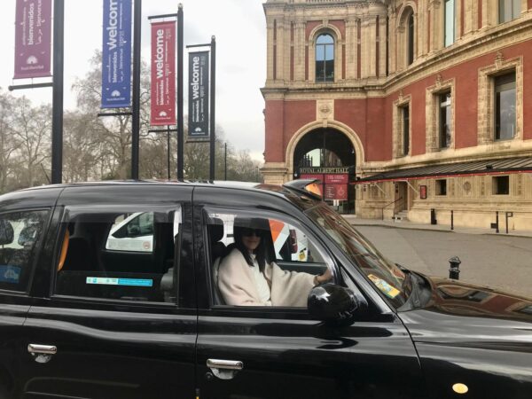 London black taxi in front of Royal Albert Hall for Harry Potter London Film Locations Walking Tour