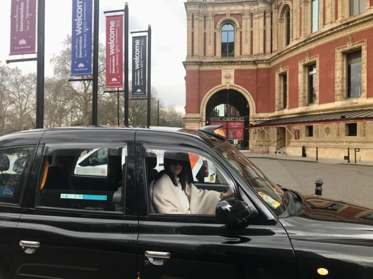 London black taxi in front of Royal Albert Hall for Harry Potter London Film Locations Walking Tour