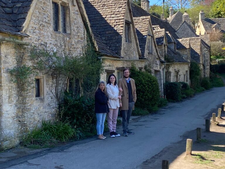 Group enjoying 3 Nights London Sightseeing Taxi Tour with iconic stone cottages, highlighting accessible tours and group value