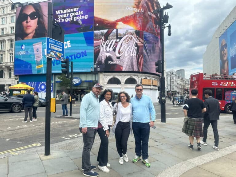 Visitors enjoying London sightseeing taxi tours at a famous London location, showcasing an itinerary for trip to London