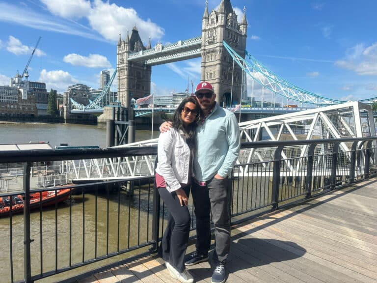 Holiday Destinations In London - People enjoying a sightseeing taxi tour near Tower Bridge, a popular tourist attraction in London