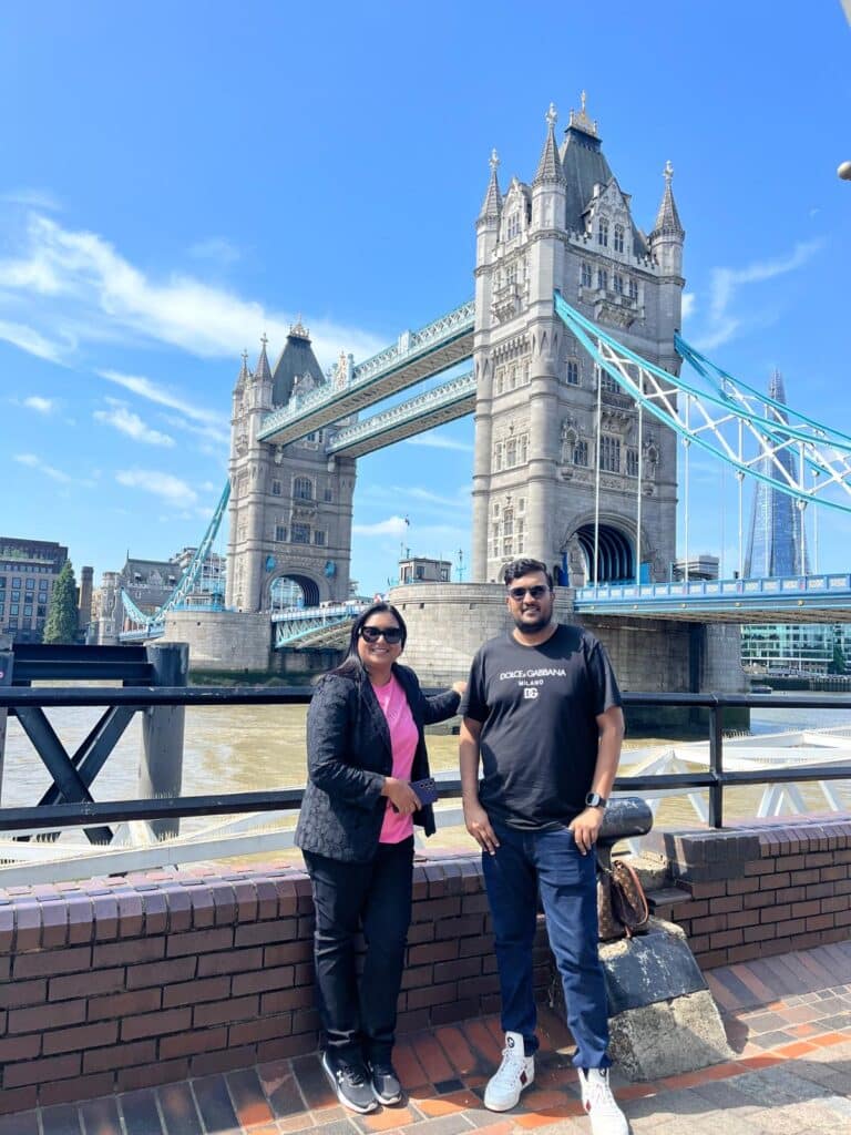 Couple enjoying Tower Bridge during day trips from London England with London Sightseeing Taxi Tours