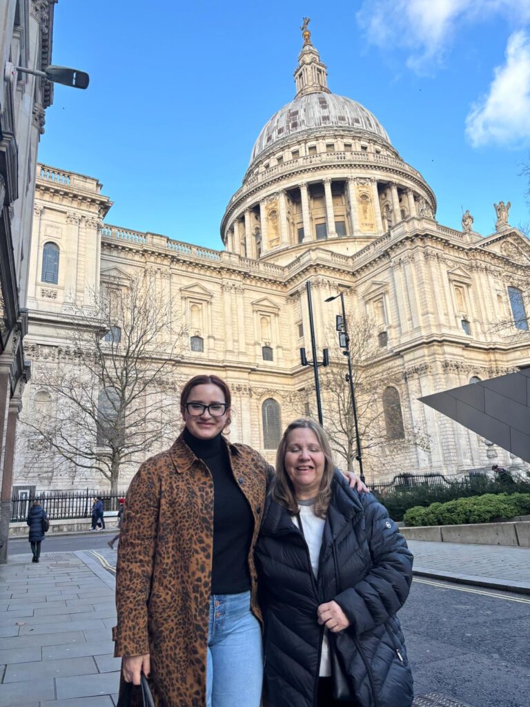 Friends posing in front of St. Paul's Cathedral during Stonehenge and Bath tours from London with accessible London Sightseeing Taxi Tours