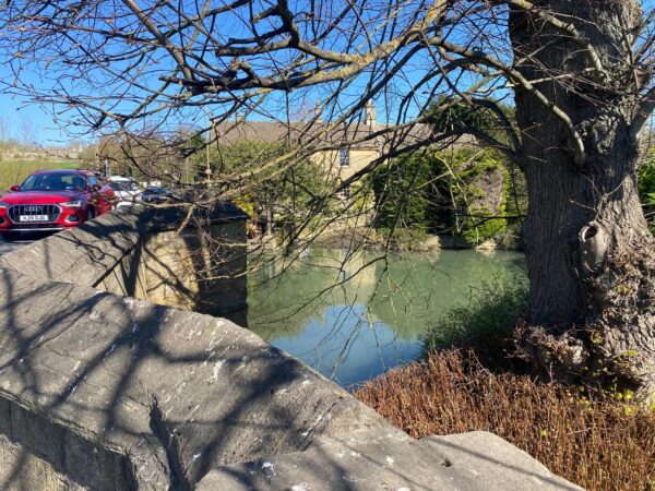 Picturesque stone bridge and river view during day trip tours from London with London Sightseeing Taxi Tours