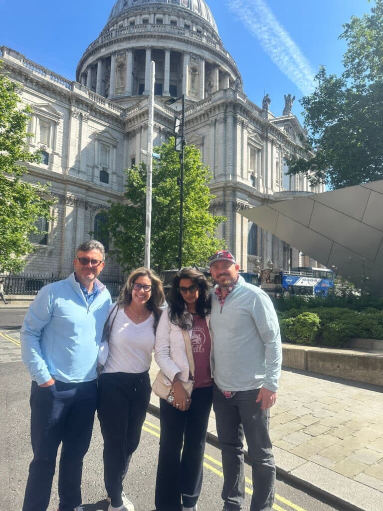 Group of visitors in a London Sightseeing Taxi Tour admiring St. Paul's Cathedral, one of the Famous Things To See In London