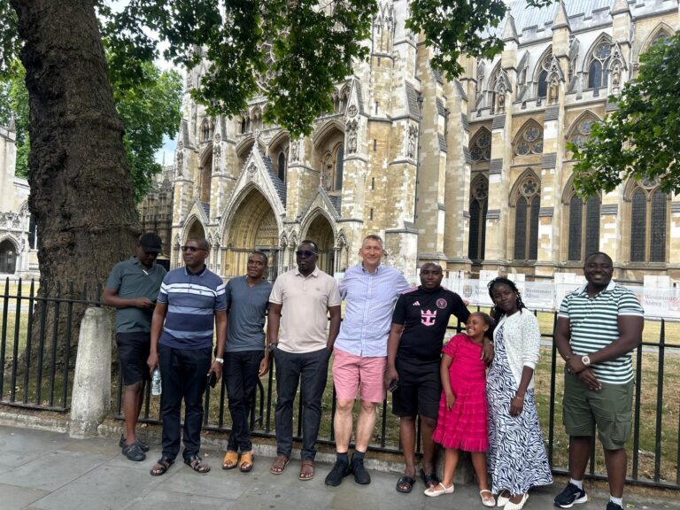 Affordable group tour in front of iconic London landmark during cheap day trip to London with London Sightseeing Taxi Tours
