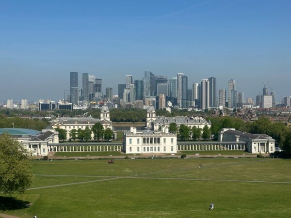 London tour companies providing accessible sightseeing taxi tours with views of the Royal Observatory and Canary Wharf skyline in London
